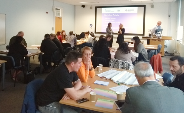 Delegates discussing issues around tables at the Leicester workshop