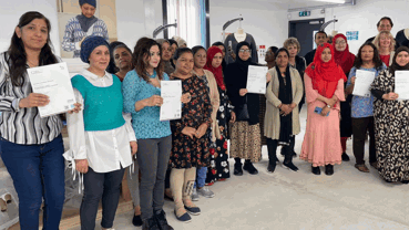 Leicester factory workers with their certificates