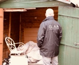 Martin Plimmer looking inside green shed in Cumbria